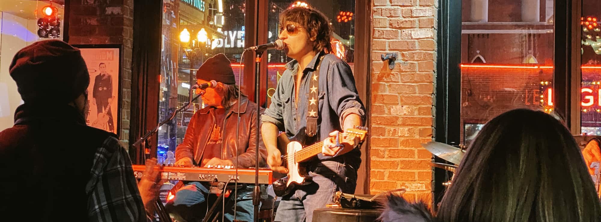 bar singer on guitar in Kansas City